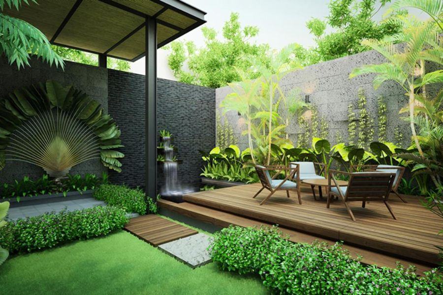 Bố Trí Cây Xanh Sân Vườn Theo Phong Thủy: Tạo Sinh Khí – Gọi Tài Lộc Cho Ngôi Nhà 4 Sân vườn biệt thự hiện đại với sàn gỗ, thác nước, bàn ghế ngoài trời và bố trí cây xanh sân vườn theo phong thủy gồm cau cảnh, vạn niên thanh, trúc vàng.