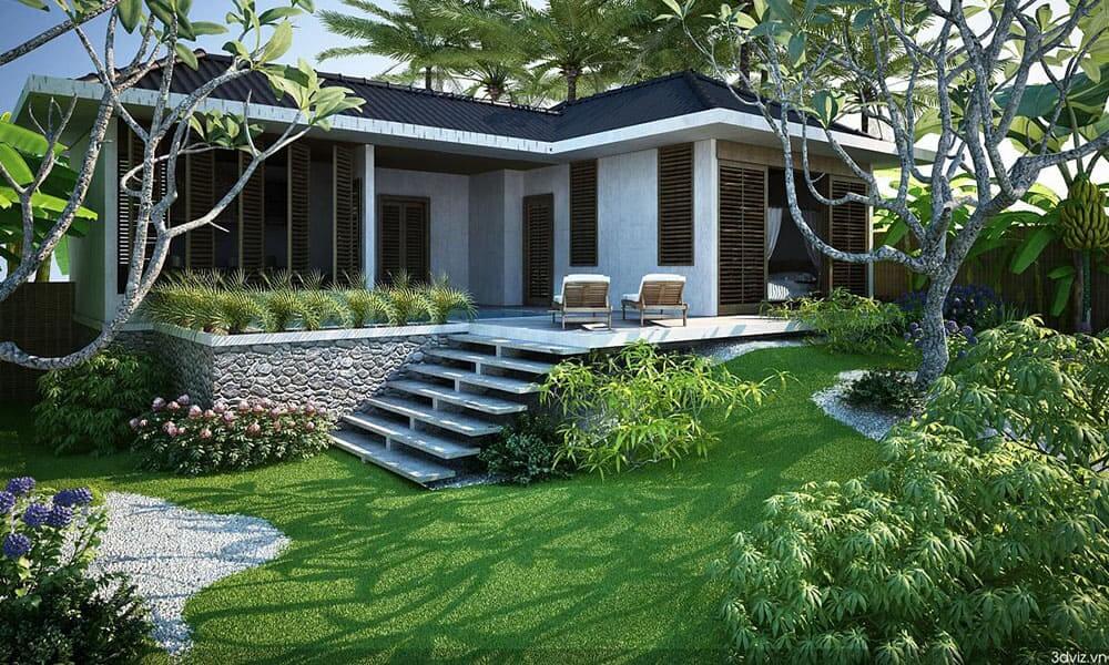 Biệt thự Tropical Modern với sân vườn Bảo Lộc xanh mát, bậc thang đá, cây xanh và lối đi sỏi trắng.