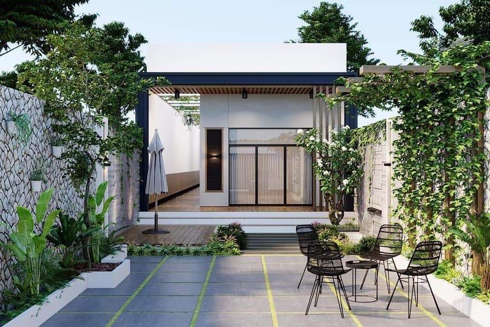 Cảnh Quan Minimalist Garden: Giải Pháp Làm Mới Không Gian Ngoài Trời Với Tối Giản Thực Dụng 4 Biệt thự hiện đại với cảnh quan Minimalist Garden gồm nền gạch tối màu, cây bản địa và không gian mở đơn giản, dễ chăm sóc và thư giãn.