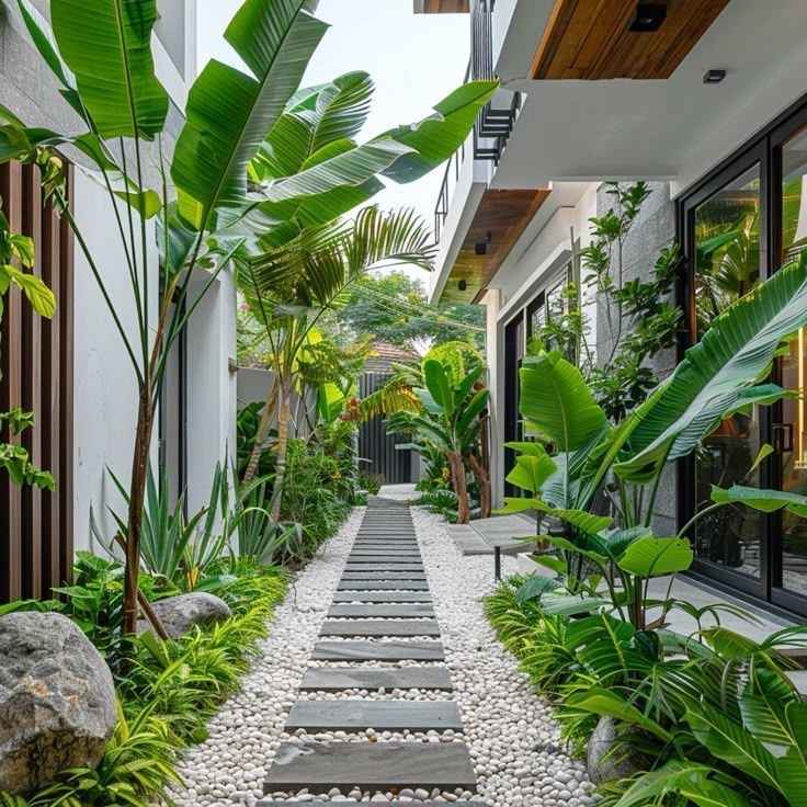 Thiết kế lối đi sân vườn với đá bước và sỏi trắng, cây xanh tươi mát.