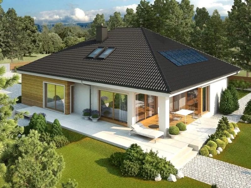 Biệt thự vườn mái Nhật hiện đại với tiểu cảnh phong thủy trước sân, lối đi lát đá, cây xanh tươi tốt và ánh sáng hài hòa.